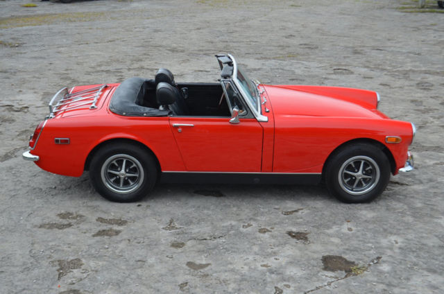 solid strong driving mg midget refurbished by british car club member