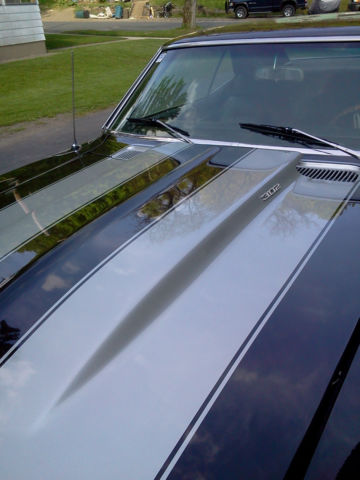 1969 camaro z28 black with silver stripes.302 dz block.frame off restoration