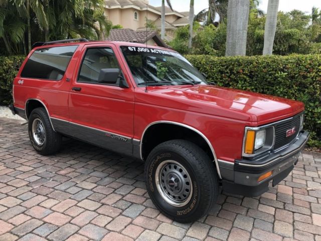 gmc jimmy red with 67,000 miles, for sale!