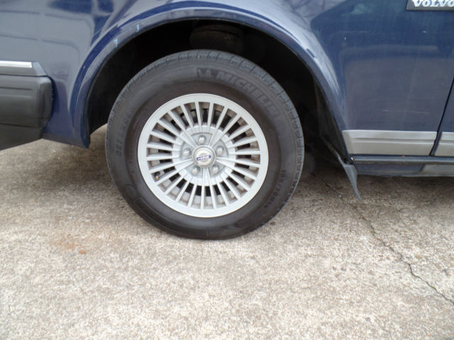 1989 blue volvo 244 sedan with a tan fabric interior. very well maintained