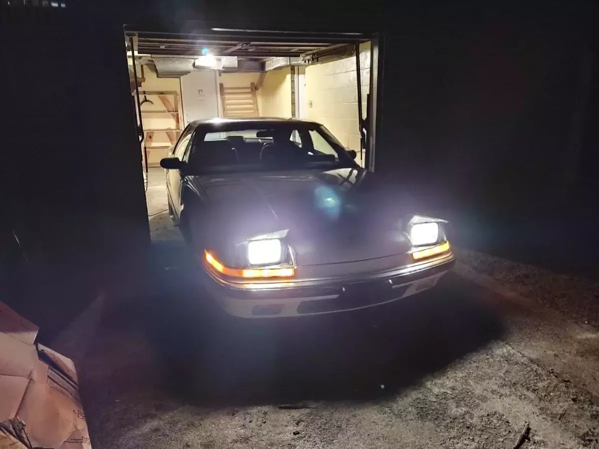 sporty white 1988 buick reatta 2dr coupe with leather interior and bucket seats