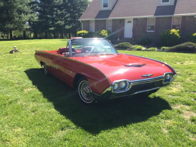 ford thunderbird with all the roadster equipment, red inside & out , white top
