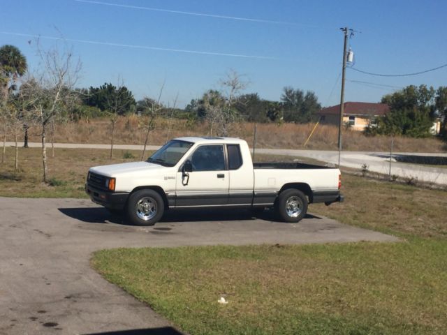 dodge ram 50 sport plus/ mitsubishi mighty max 85k survivor truck