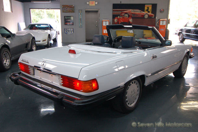 only 61,145 original miles, stunnging condition, artic white/blue, both tops