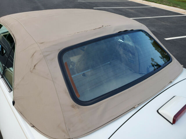 convertible - 50k miles only - tan leather - garage kept no rust - british white