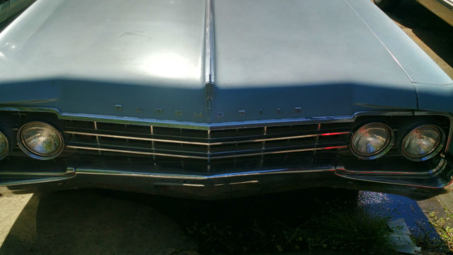 vintage blue oldsmobile 2dr in great condition