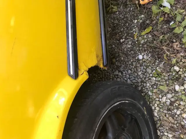 yellow 1990 bmw 325i convertible