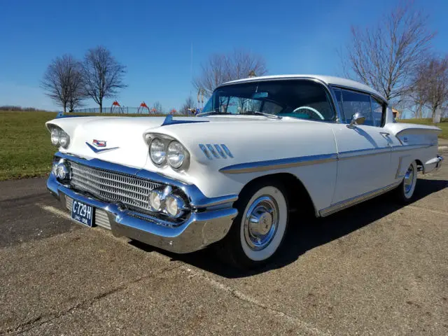 white ext. & turquoise int. frame off restoration, 348 ci v8, automatic, 3 speed