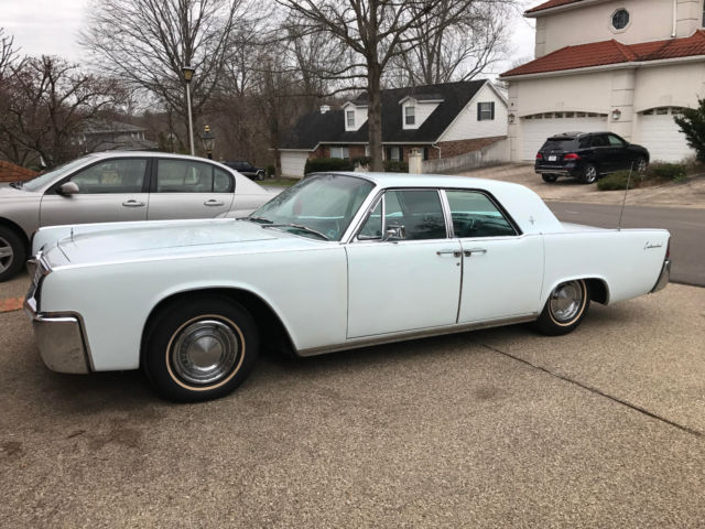1962 blue lincoln continental 4 door