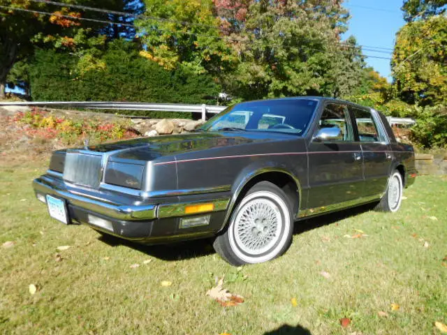only 26.000 miles one owner loaded front wheel drive new yorker 4 door sedan