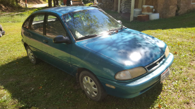 blue base 4-door with hatchback, good condition considering age, drives great