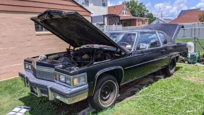 1979 black cadillac deville with red interior