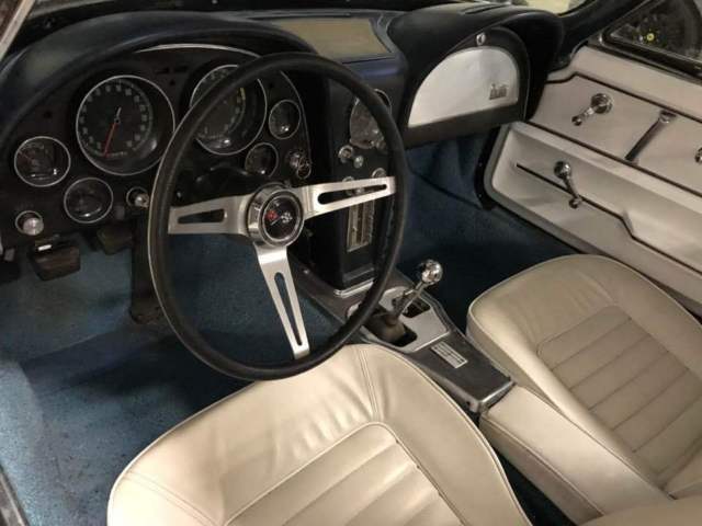 convertible, four speed, leather, disc brakes, power brakes, side pipes