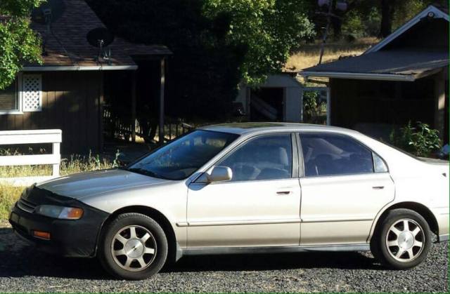 reliable gold honda accord mid-size sedan in good condition