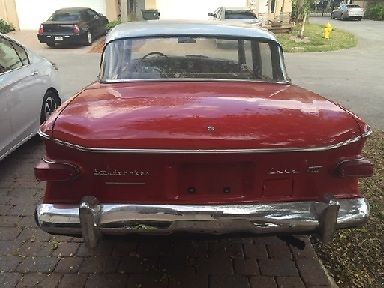 1960 studebaker lark 4 door sedan v8 automatic 3 speed with red & white exterior