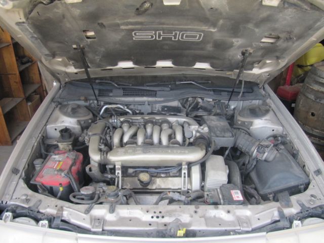two (2) 1989 ford taurus sho, one very good running car the other is a parts car