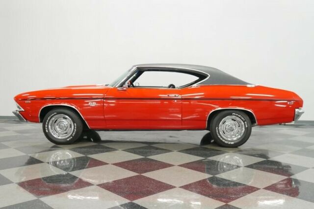 restored red over black big block 4 speed chevelle