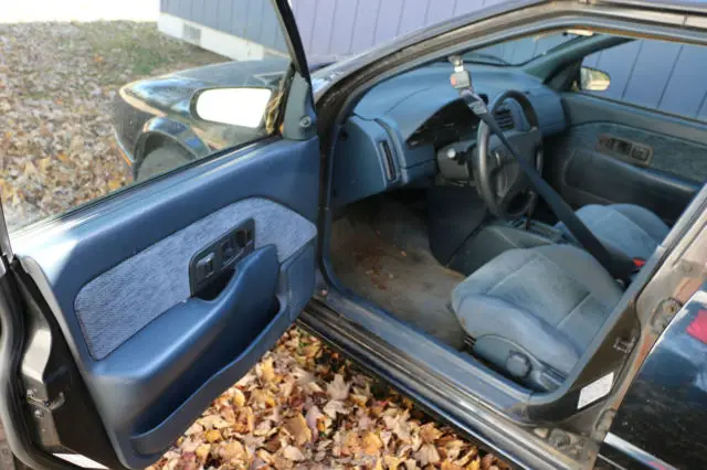 1994 blue black saturn sl2 4 door car w/options & about 110,000 miles, one owner