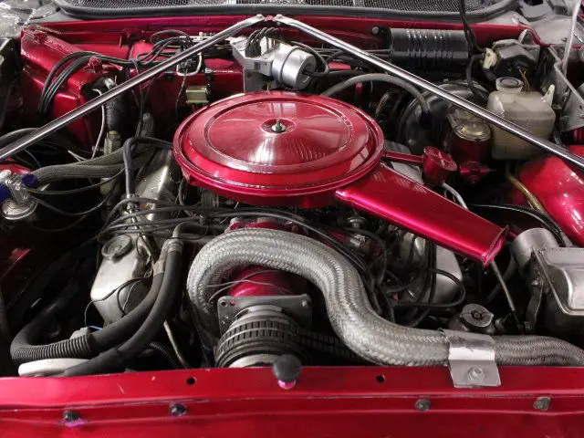 candy magenta red paint, big 472 v8 under the hood, white interior