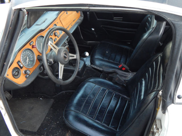 1974 1/2 chiclet tr 6. white. 46,000 original miles. with an extra set of wheels