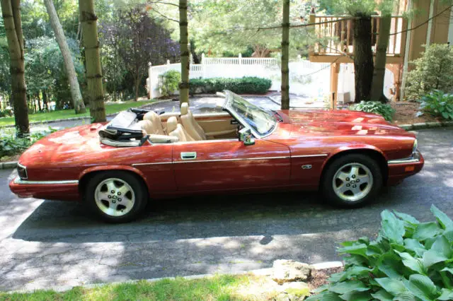 beautiful 1994 jaguar convertible with only 59000 miles.bergundy/tan interior