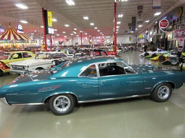 beautiful factory tri-power four speed gto!!!