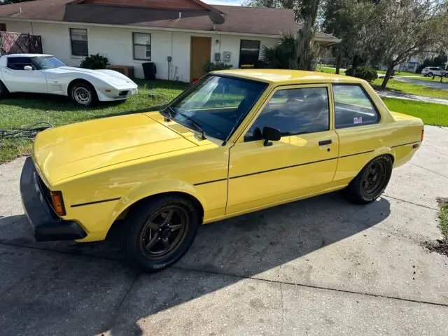 1981 toyota corolla sedan yellow rwd manual