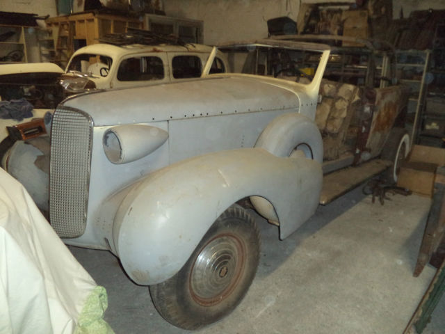 cadillac v12 convertible sedan, series 75/ 85, dual sidemounts, divider window