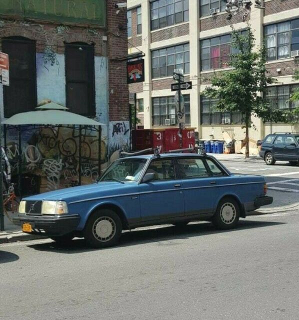 volvo 240 sedan in rare blue, collectible car growing in value, very reliable