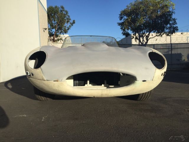 1965 jaguar e-type xke series one 4.2 liter roadster. white on black. 4-speed