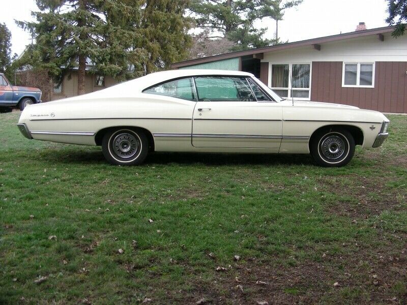 1967 chevroletimpala2 dr hardtop52,297 milescreamsedan275-horsepower 327 cubic-i