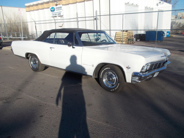 1965 chevrolet impala convertable , black interior with bucket seats & console