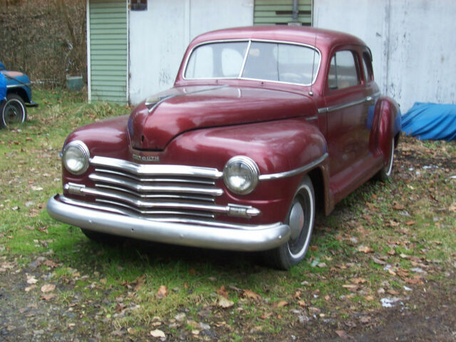 1948 plymouth special deluxe coupe burgundy with tan vinyl interior very nice