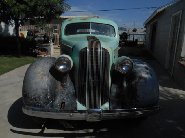 1935 pontiac car sedan four doors suicide