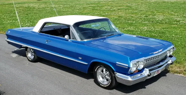 1963 chevy impala 4 speed, bucket seats,blue& white,classic cragar ss rims maine