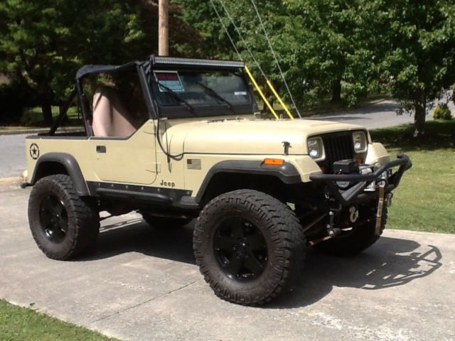 nice! built 1990 yj jeep wrangler desert tan on 35" nittos w/ wench & tube bumps