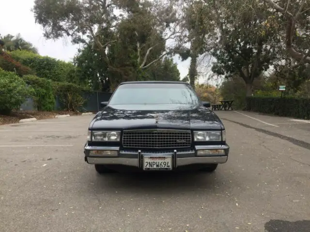 1989 cadillac fleetwood with leather interior and top (like new) with 55k miles