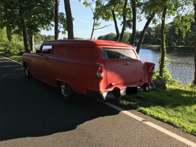 chopped 55 chevy wagon with big block chevy and mini tubs