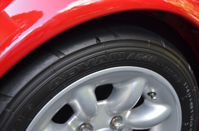 classic mini cooper coupe. flame red. many performance modifications
