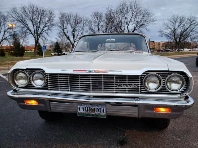 1964 chevy impala convertible, pearl white with white top and red interior