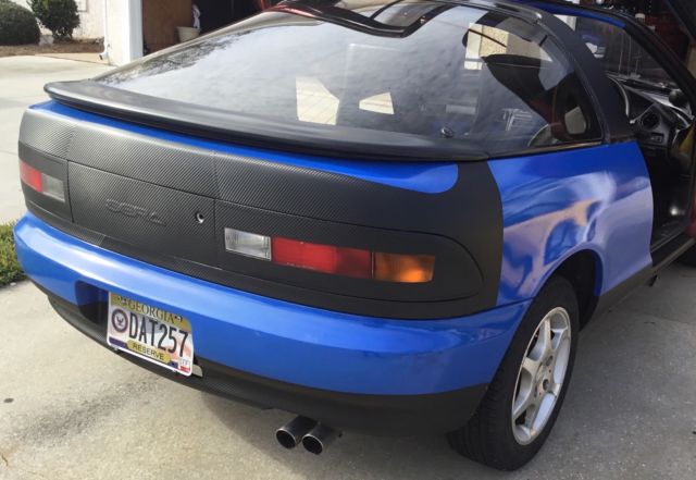 classic 1991 toyota sera imported from japan wrapped in blue and carbon fiber