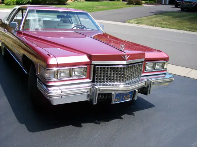 fantastic 1975 cadillac coupe deville red, white top, white leather. 32k miles