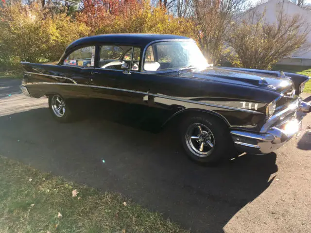 1957 chevy belair black 2 door post with 283 power pack heads
