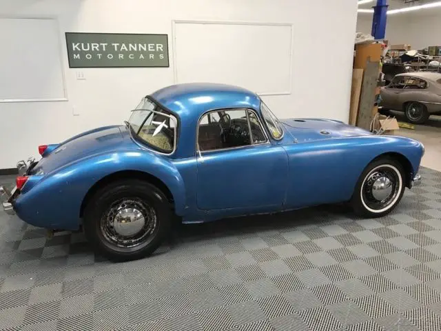1957 mga 1500 coupe. rare original colors of black with red trim. very complete