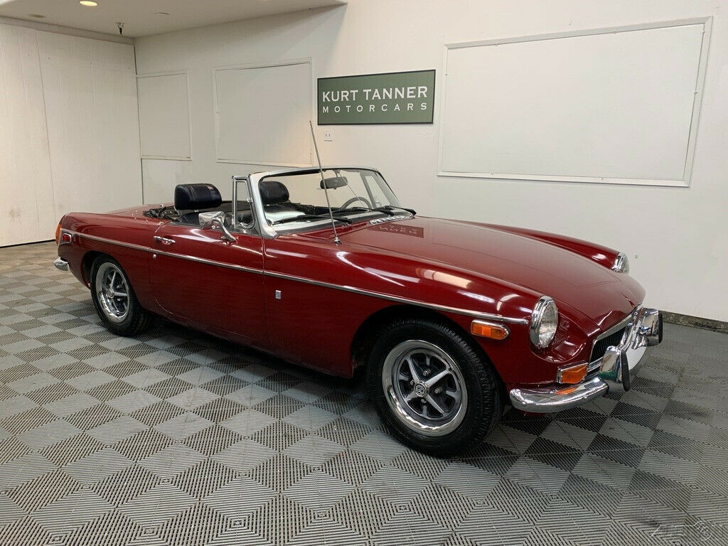 1973 mgb roadster. damask red with navy blue trim. rostyle wheels. 57,943 miles