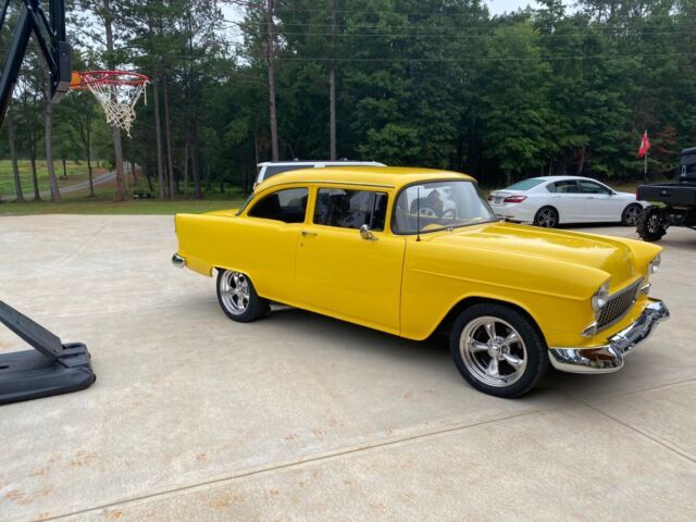 1955 chevrolet 150 sedan yellow rwd manual 150 post