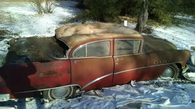 red, 4 doors, bench sitting front and rear, full restoration work needed