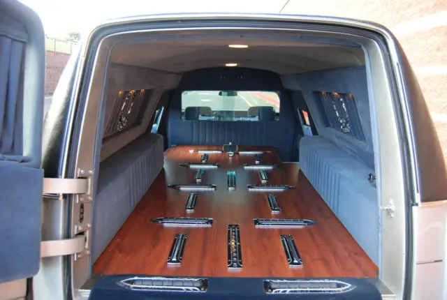 funeral hearse cadillac fleetwood silver, black vinyl top, clean garage kept