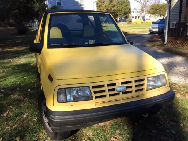1992 convertible geo tracker 4 wd, yellow with yellow/black interior