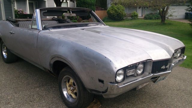 not a cutlass. a real ebony black 442 convertible. disc brakes and 12 bolt posi